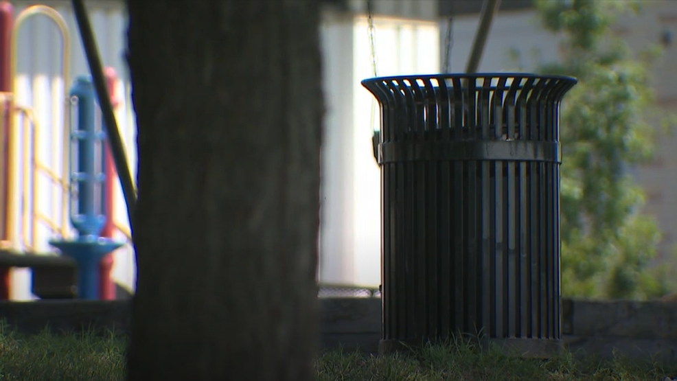 East Baltimore Neighborhood Picking Up Trash, Emptying Trash Cans to