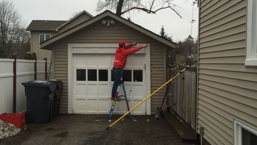 bradley lackie who works for shine window care and holiday lights of midland says the warm weather makes it easier to take down christmas lights - When To Take Down Christmas Lights bradley lackie who works for shine window care and holiday lights of midland says the warm weather makes it easier to take down christmas lights - When To Take Down Christmas Lights